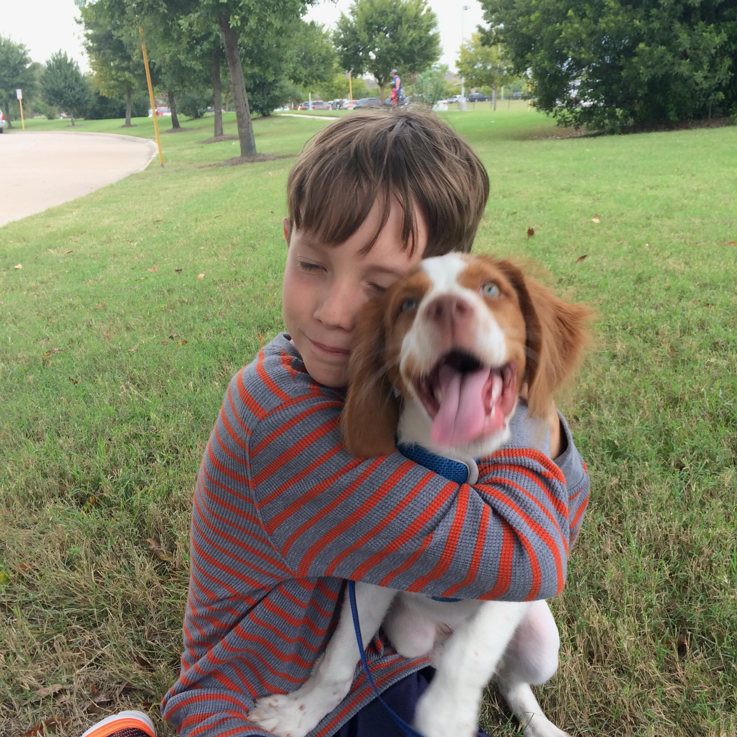 Micah holding puppy Sundance.